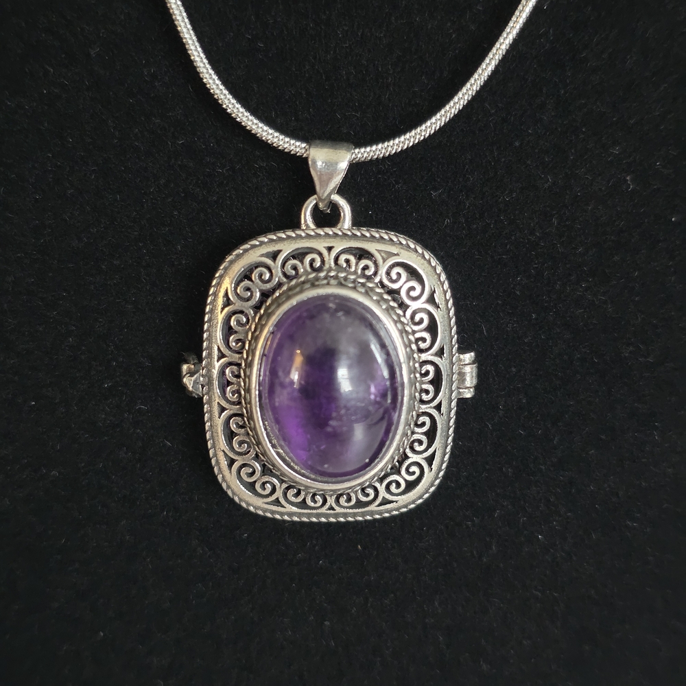 Intricate Amethyst Locket Necklace with chain.